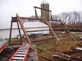 Camp Barn Frame Dismantle / A bent being laid down